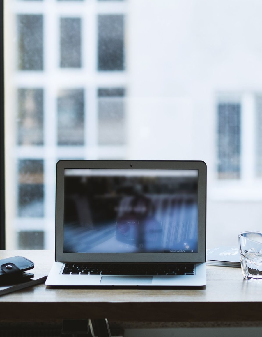 A modern workspace representing the desktop and mobile apps available from the Lauxon app store.